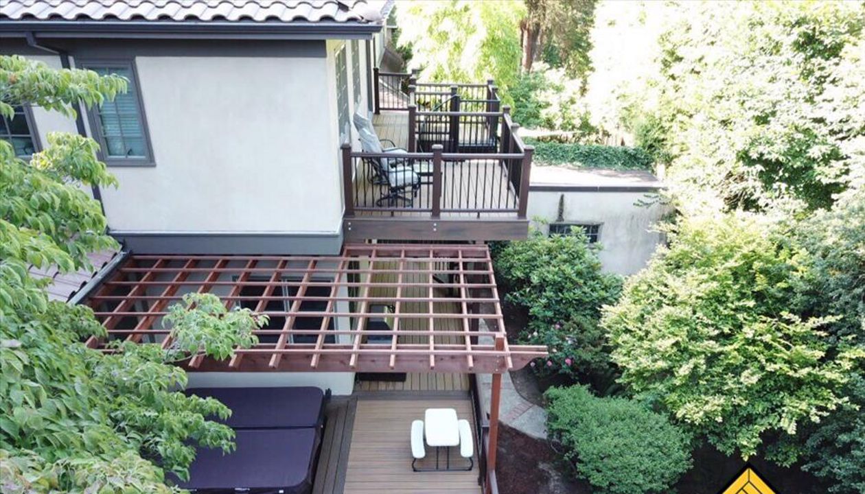 Portland Deck featuring Trex Havana Gold, Transcend Railing, Trex Lighting, Fascia, Trex Spiral Staircase.