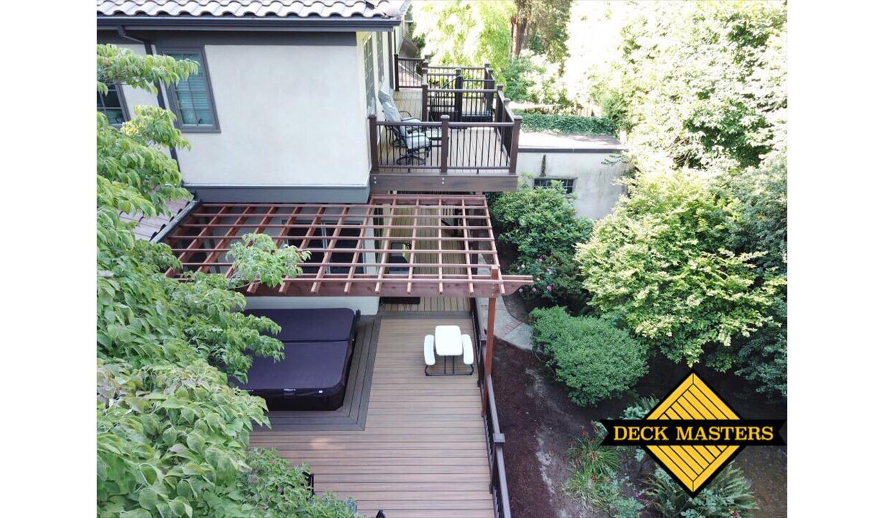 Portland Deck featuring Trex Havana Gold, Transcend Railing, Trex Lighting, Fascia, Trex Spiral Staircase.