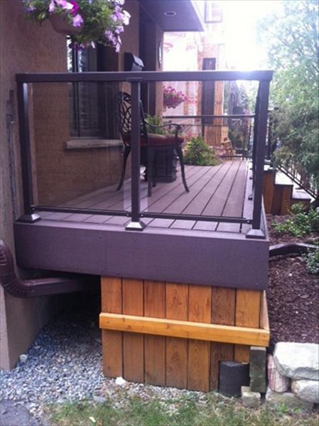Trex Transcend Gravel Path custom made COMPOSITE porch with black aluminum railing and solid skirting.The Porch built in Toronto, Mississauga, Scarborough, Etobicoke, North York, Markham, Richmond Hill, Thornhill, Vaughan