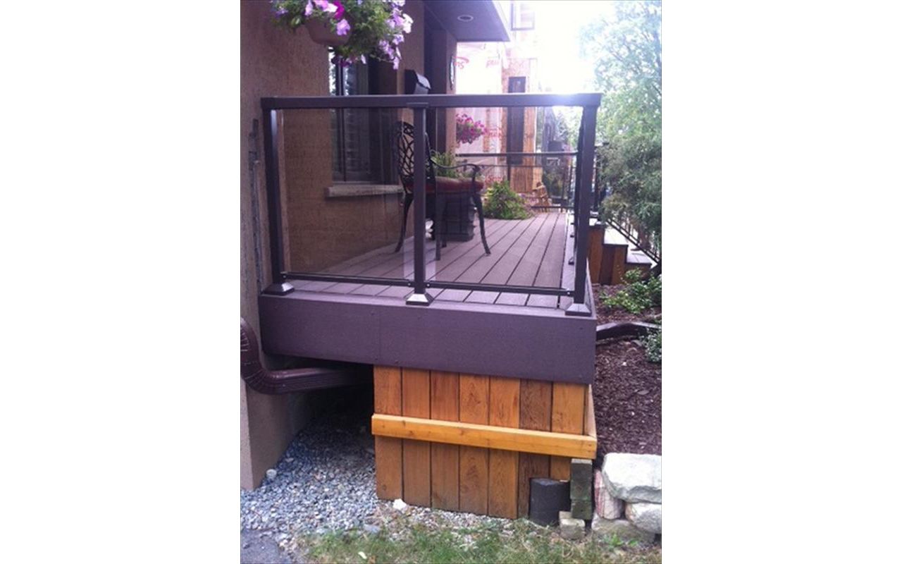 Trex Transcend Gravel Path custom made COMPOSITE porch with black aluminum railing and solid skirting.The Porch built in Toronto, Mississauga, Scarborough, Etobicoke, North York, Markham, Richmond Hill, Thornhill, Vaughan