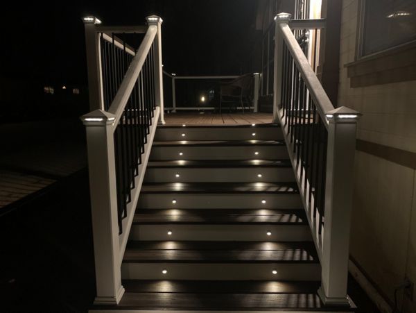 Deck and railing with lighting at night