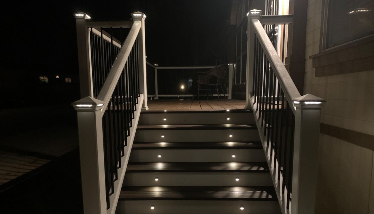 Deck and railing with lighting at night