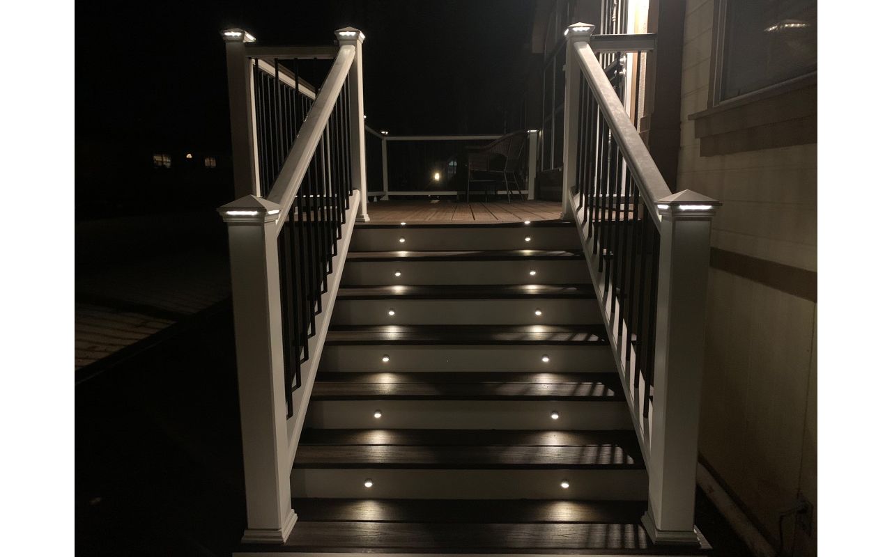 Deck and railing with lighting at night