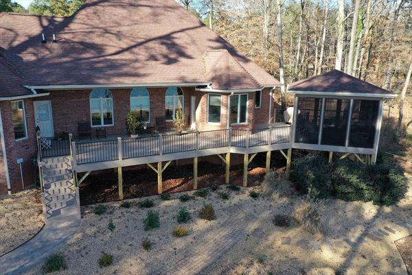 Beautiful Rope Swing composite deck connected to a screened in Gazebo