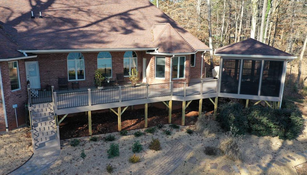 Beautiful Rope Swing composite deck connected to a screened in Gazebo
