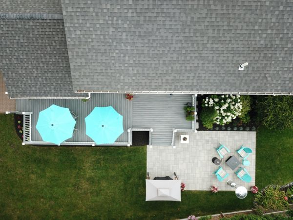 Amazing 2-Tier 500 Square Foot Outdoor Living Deck Space, Trex Transcend Island Mist Decking with Trex Transcend White Composite Railings and Island Mist Cocktail Rails, in Peabody, MA