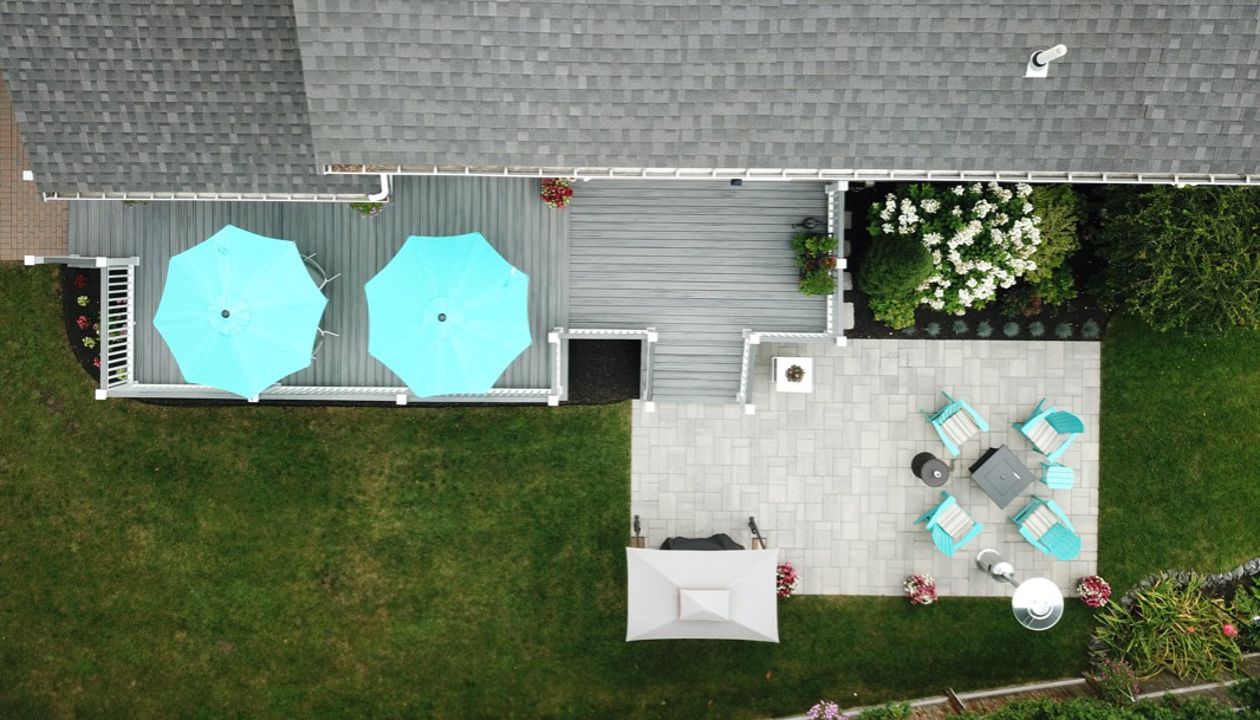 Amazing 2-Tier 500 Square Foot Outdoor Living Deck Space, Trex Transcend Island Mist Decking with Trex Transcend White Composite Railings and Island Mist Cocktail Rails, in Peabody, MA