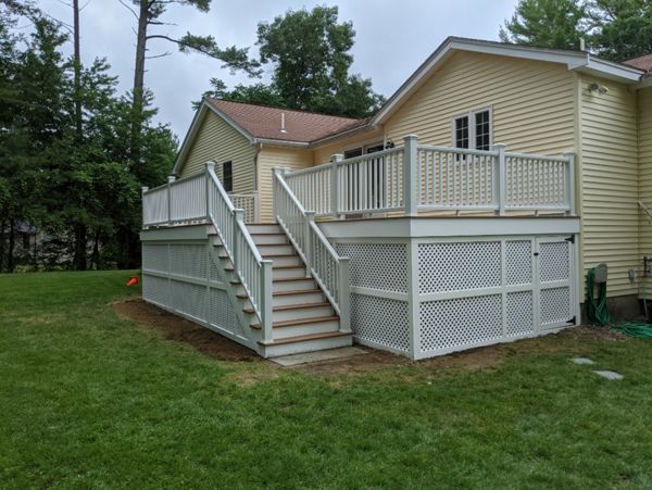 Trex Transcend "Tiki Torch" decking with white Transcend railings.
