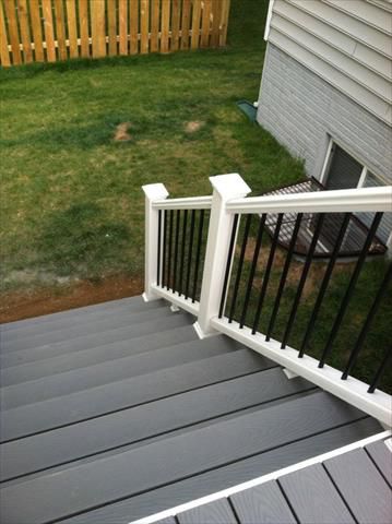 White Trex Transcend stair railings with black aluminum ball