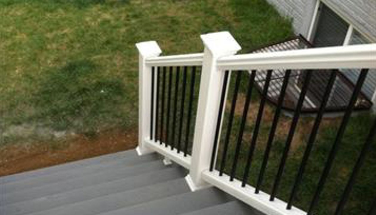 White Trex Transcend stair railings with black aluminum ball