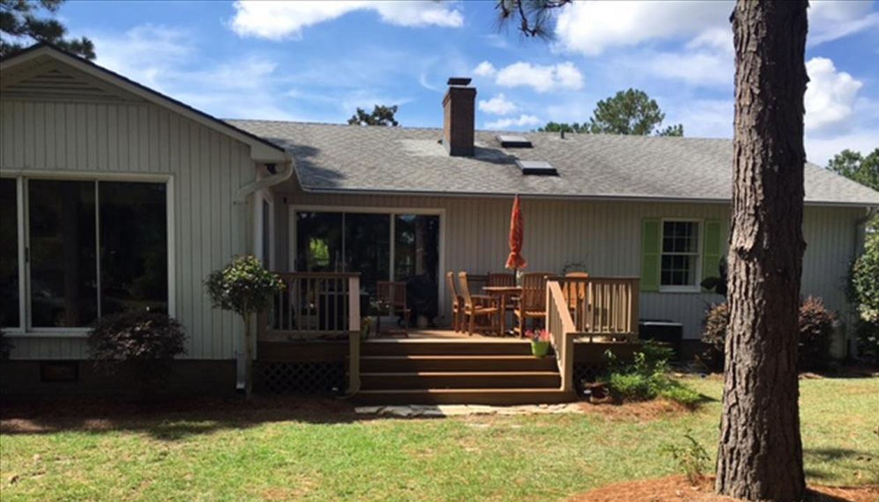 Trex Transcend Havana Gold deck with Rope Swing picture frame & railing in New Bern, NC.