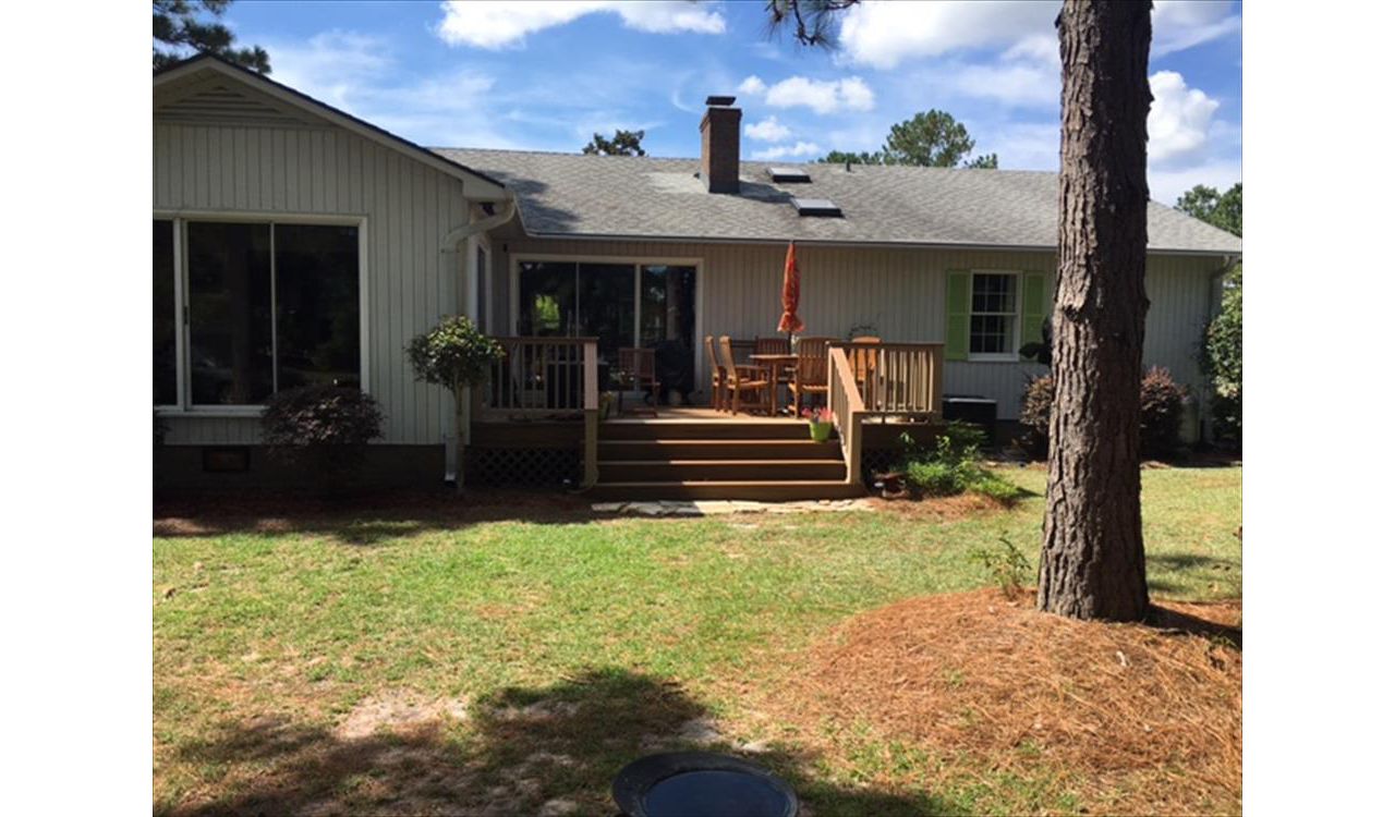 Trex Transcend Havana Gold deck with Rope Swing picture frame & railing in New Bern, NC.