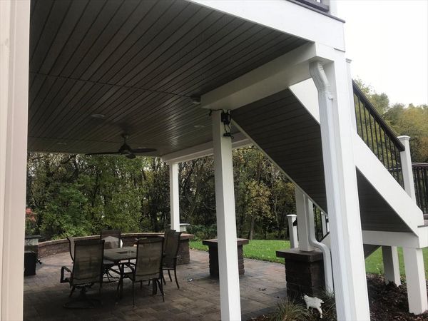 Trex Transcend Composite Deck & Rail with Finished Outdoor Living Space Underneath Thanks to Trex Rain Escapes Drainage System in Rochester, MN