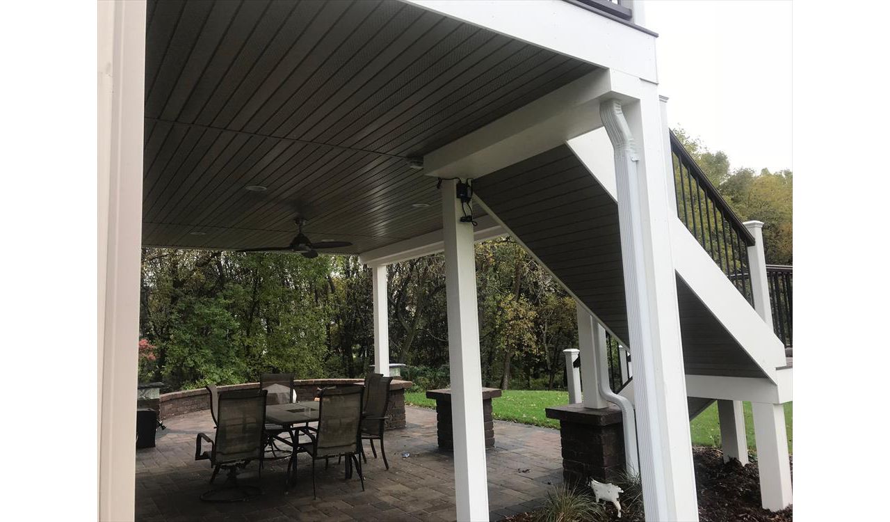 Trex Transcend Composite Deck & Rail with Finished Outdoor Living Space Underneath Thanks to Trex Rain Escapes Drainage System in Rochester, MN