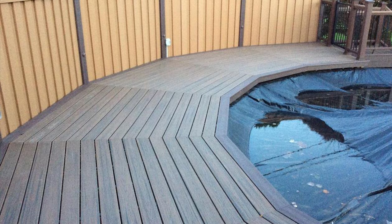 Trex Seclusions privacy fencing around Spiced Rum pool deck.