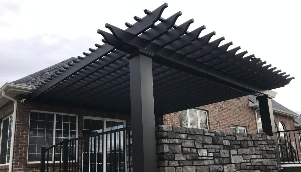 Trex Island mist, signature railing, along with outdoor kitchen, & arbor