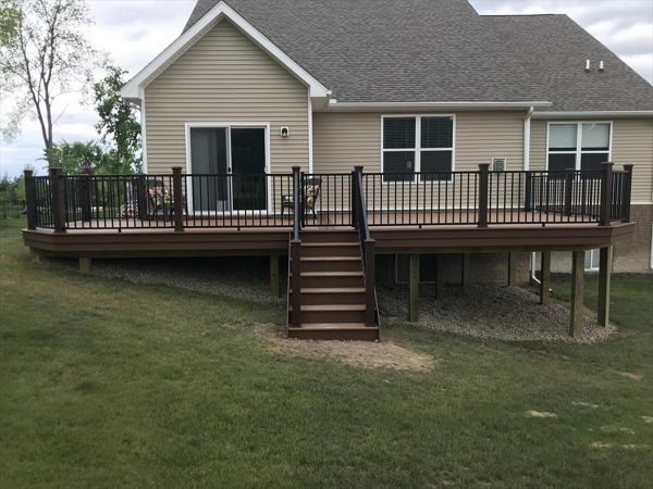 Trex Beach Dune decking with a double Saddle border. Also including a Trex Signature black railing & gate.