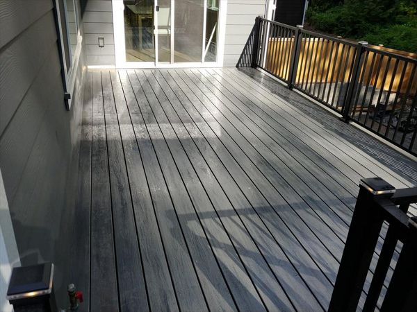 Trex Transcend Tropicals Island Mist with Trex Signature Black aluminum rails with Trex LED lighted post caps.