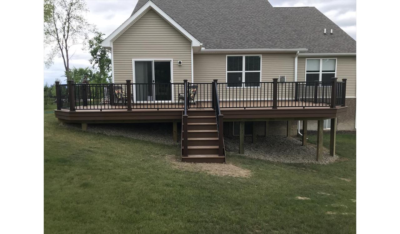 Trex Beach Dune decking with a double Saddle border. Also including a Trex Signature black railing & gate.