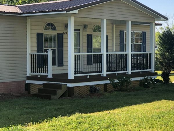 Great new Trex Enhance Saddle porch with Trex Transcend Classic White railings in Fayetteville, NC