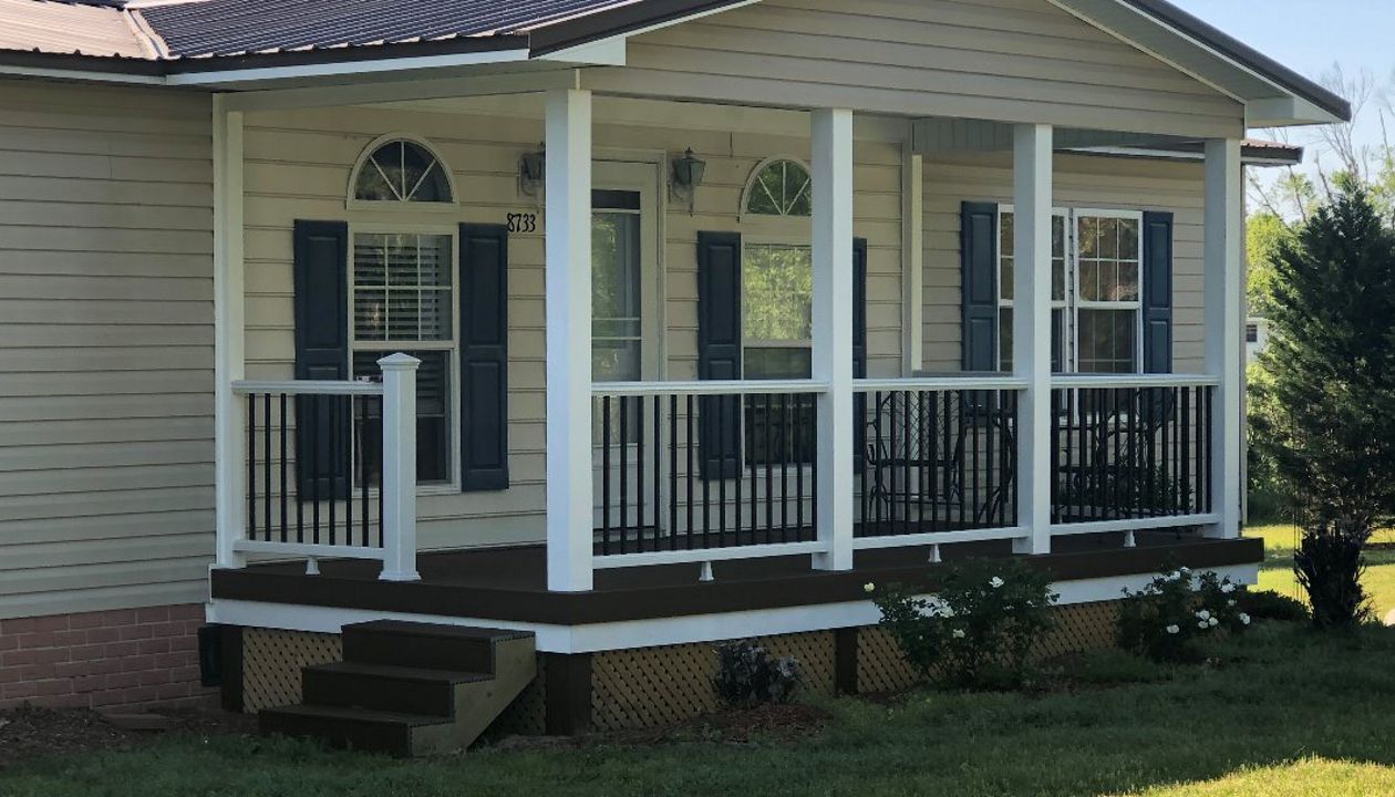 Great new Trex Enhance Saddle porch with Trex Transcend Classic White railings in Fayetteville, NC