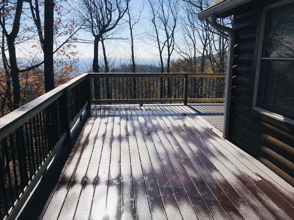 This Trex Select Madeira deck wraps around this home with a fantastic view of the mountains