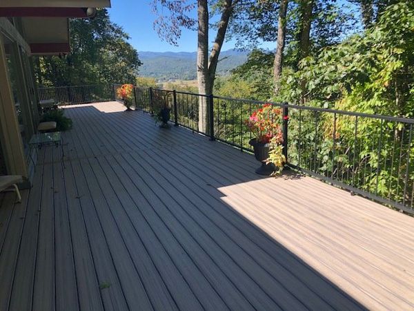 What an amazing view & outdoor living space from this new Trex Enhance Naturals Rocky Harbor deck!