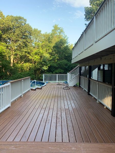 Transcend Classic white railing. TREX Transcend Tiki Torch decking.