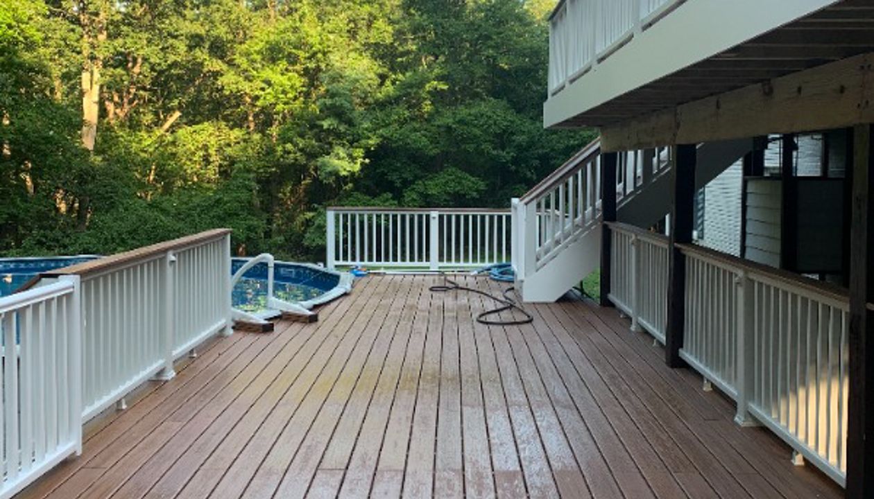 Transcend Classic white railing. TREX Transcend Tiki Torch decking.