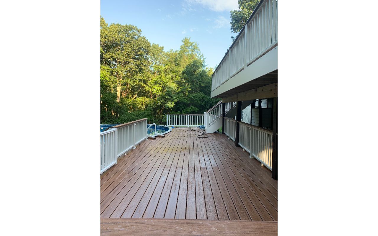 Transcend Classic white railing. TREX Transcend Tiki Torch decking.