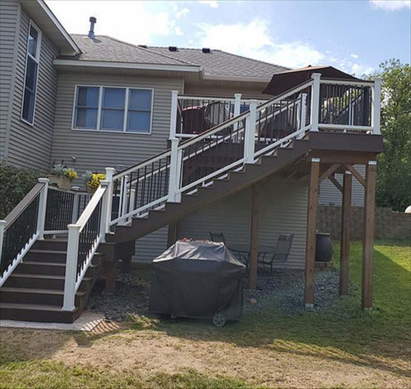 Trex Transcend Decking and Railing. Decking is Spiced Rum and the Railing is Classic White with Black, Aluminum Balusters and a Spiced Rum Deck Board Drink Rail on top of the Railing