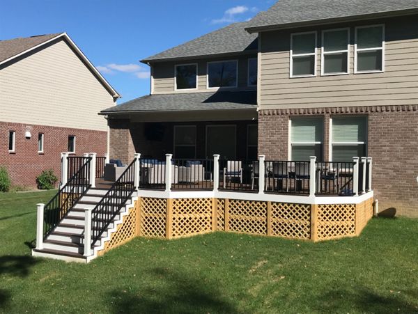 Trex Signature Aluminum Railing with Composite Posts, and Lattice Deck Skirting.