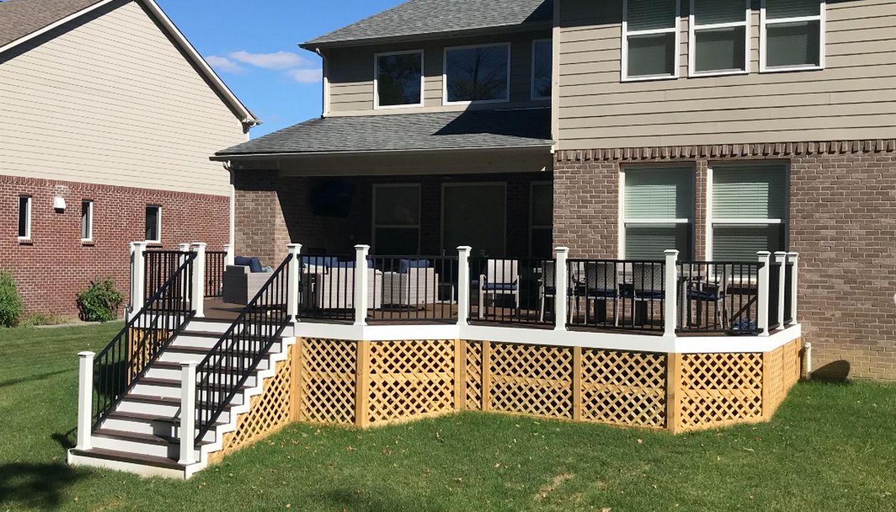 Trex Signature Aluminum Railing with Composite Posts, and Lattice Deck Skirting.