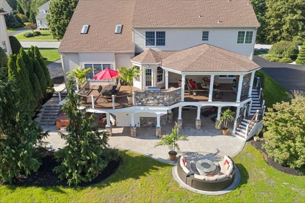 Trex Transcend Spiced Rum and Vintage Lantern Deck, Vintage Lantern Rail with White Posts and Black balusters, custom roof, storage and grill island.