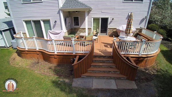 Custom curved Tiki Torch Decking with Tiki Torch Cocktail Rail and stone faced risers in HoHoKus, NJ