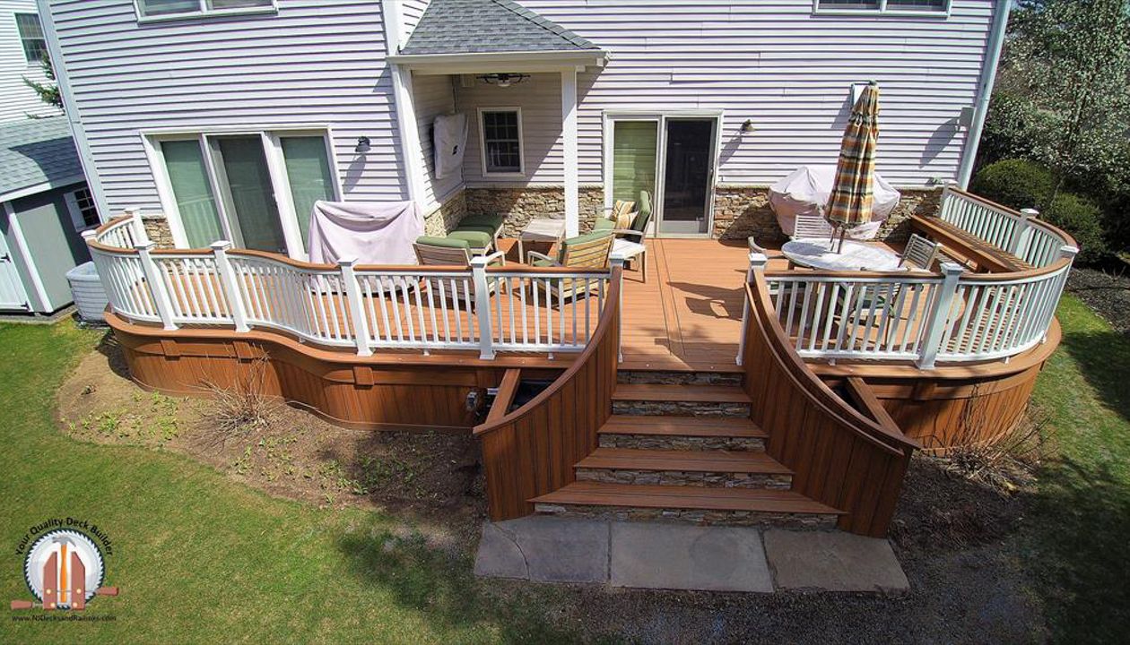 Custom curved Tiki Torch Decking with Tiki Torch Cocktail Rail and stone faced risers in HoHoKus, NJ