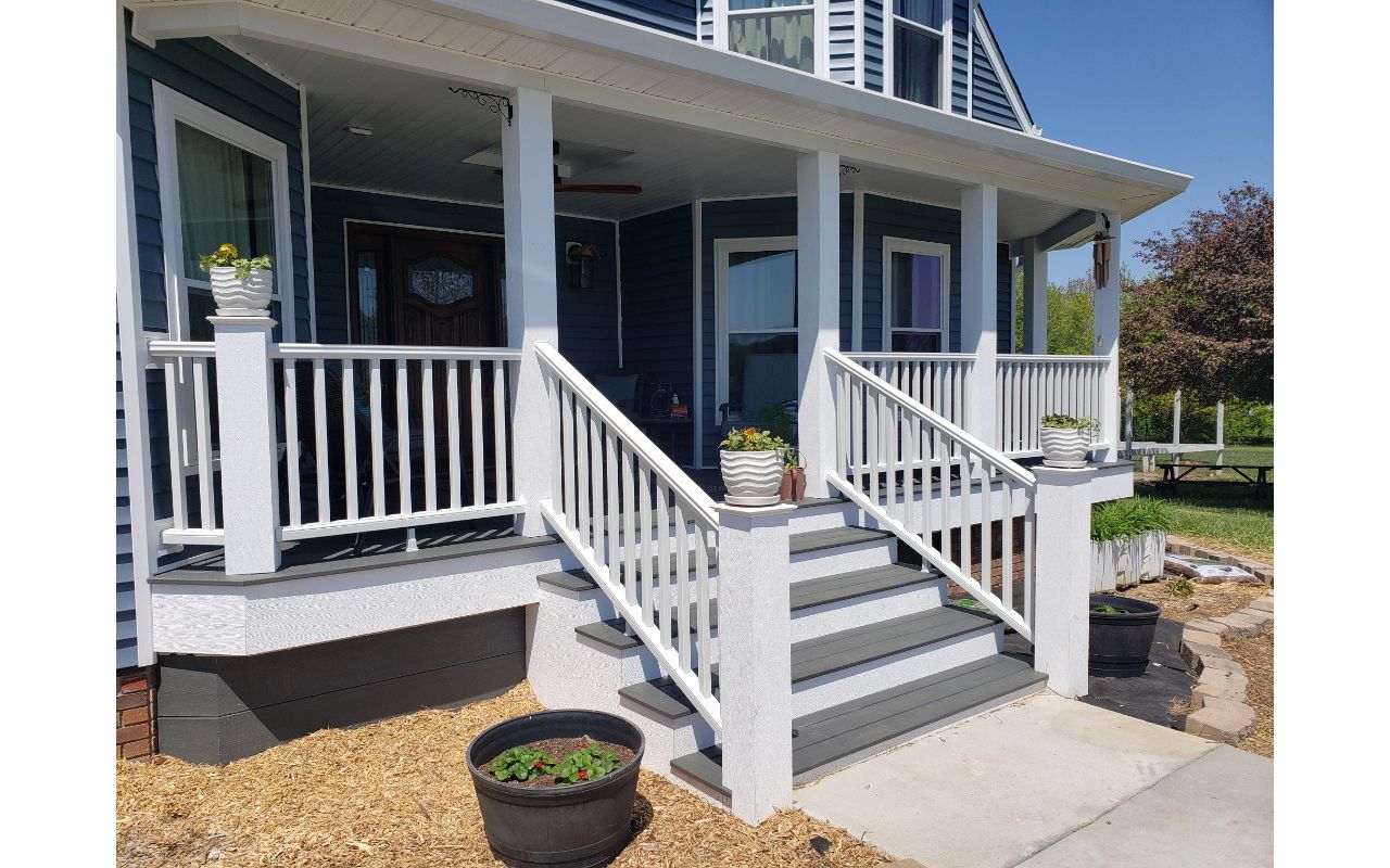 New front porch we built for this home using Trex decking, handrails and fascia - included adding a roof over the porch