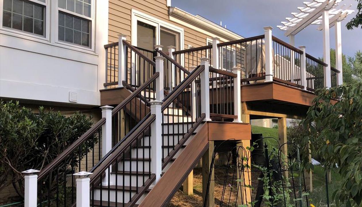 tiki torch skirt, lava rock treads, white risers, vintage lantern railing, white sleeves.