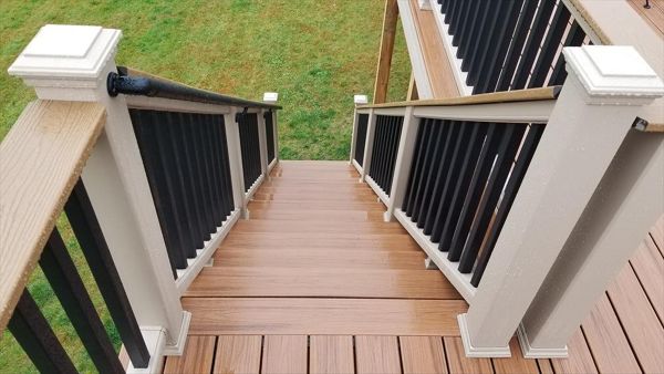 Trex Transcend Tropics Tiki Torch deck boards with Transcend railing (Rope Swing rails with Black balusters and Enhance Beach Dune Drink Rail), Rope Swing fascia serving the Twin Cites, Hastings, Woodbury, Egan, Edina, Minneapolis, Lake of the Isles