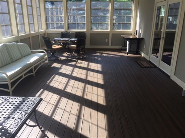 Trex Transcend Spiced Rum porch plank on 3 seaons room gives the look of a continuous tongue & groove hardwood flooring with the durability & low maintenance of Trex!