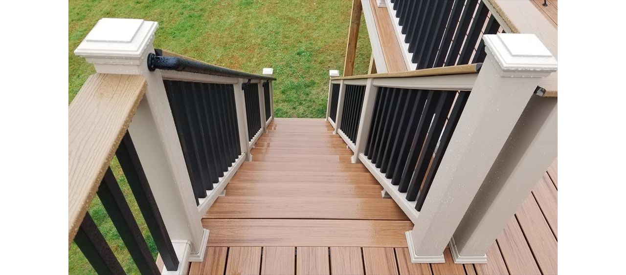 Trex Transcend Tropics Tiki Torch deck boards with Transcend railing (Rope Swing rails with Black balusters and Enhance Beach Dune Drink Rail), Rope Swing fascia serving the Twin Cites, Hastings, Woodbury, Egan, Edina, Minneapolis, Lake of the Isles