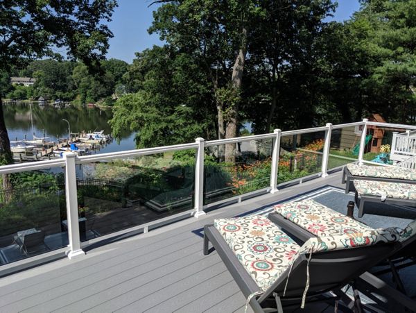 Trex Select Pebble Gray Composite Decking with White Aluminum Railing with Full Glass Panel Infills in Severna Park MD