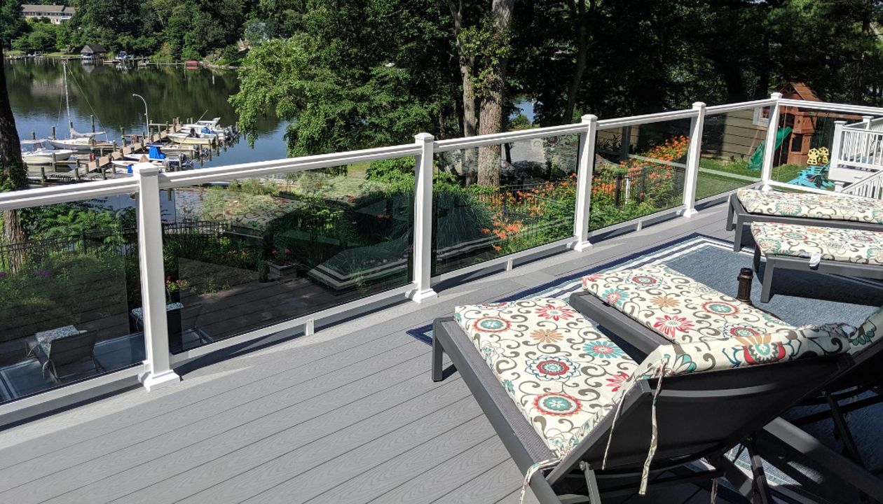 Trex Select Pebble Gray Composite Decking with White Aluminum Railing with Full Glass Panel Infills in Severna Park MD