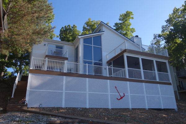 Statement Piece for the Lake Front done with Select Saddle with aluminum railing done in Lake Ozark, Mo