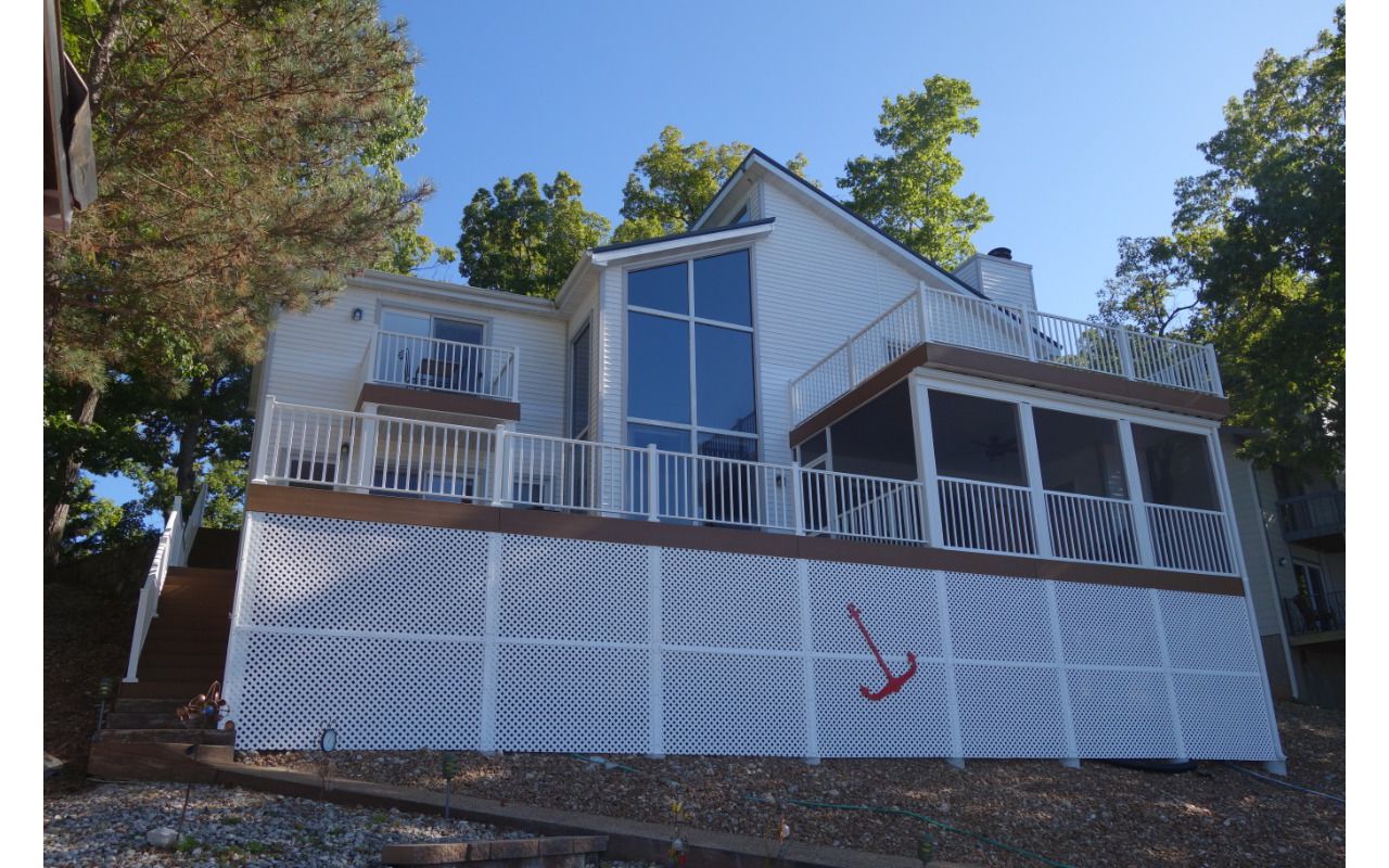 Statement Piece for the Lake Front done with Select Saddle with aluminum railing done in Lake Ozark, Mo