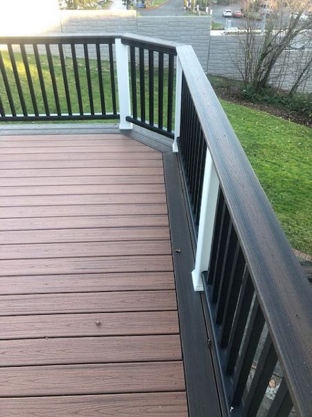 Trex Transcend Tiki Torch body w/ Spice rum boarder. Transcend railing w/ cocktail top cap and rain escape