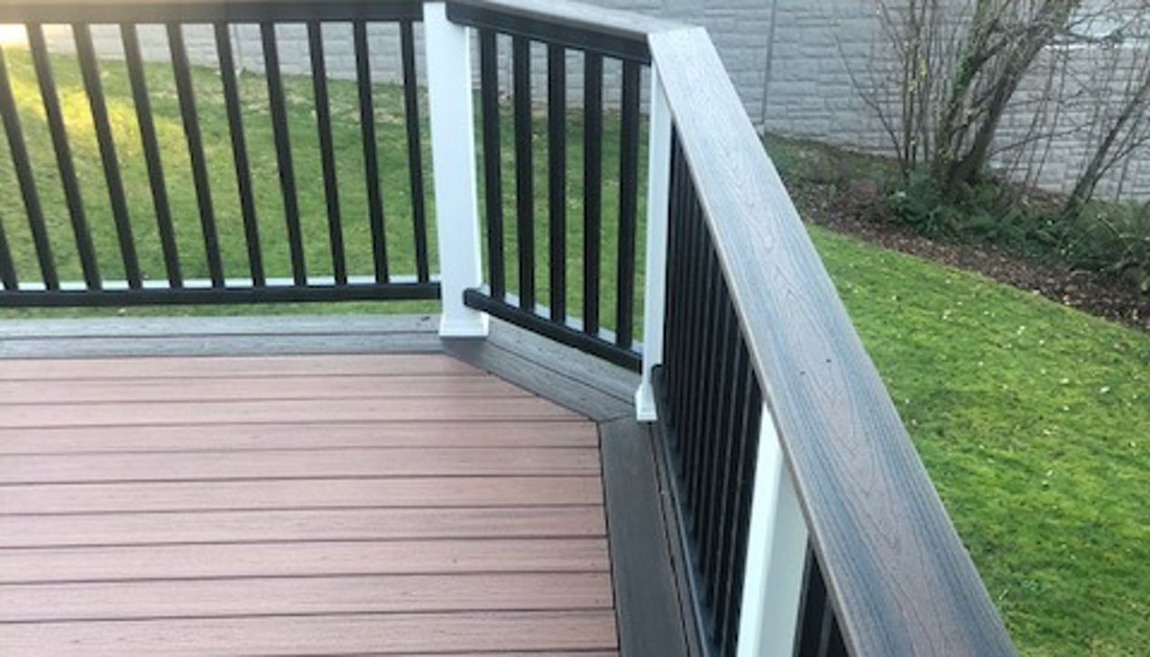 Trex Transcend Tiki Torch body w/ Spice rum boarder. Transcend railing w/ cocktail top cap and rain escape