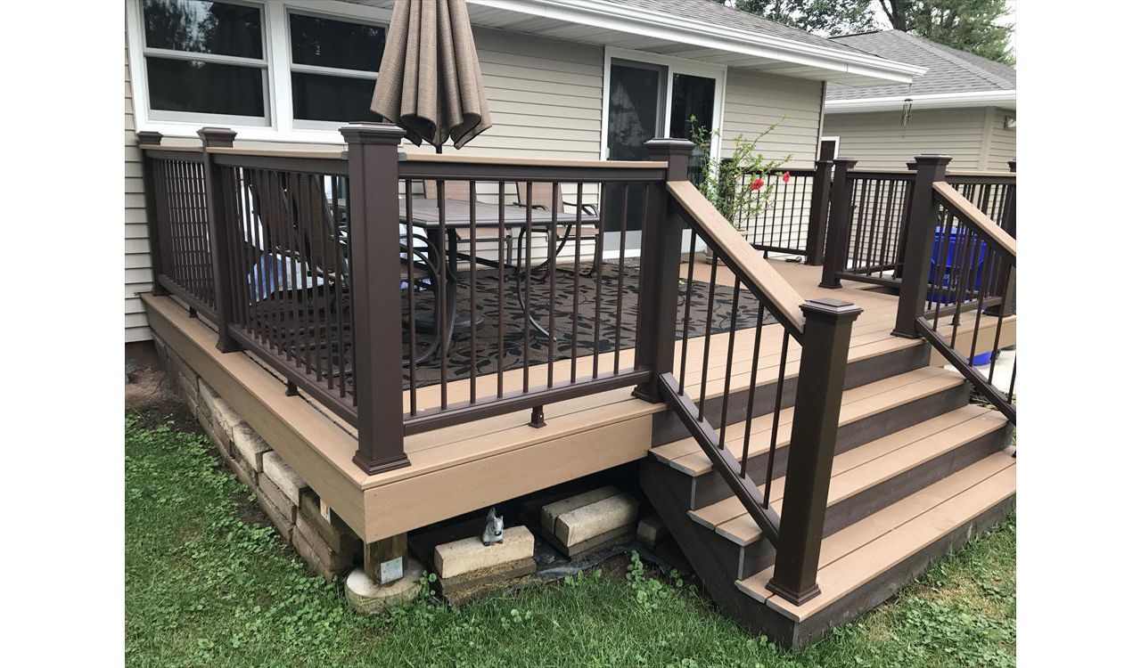 Trex deck features vintage lantern and saddle color in Kaukauna by GE Contracting LLC