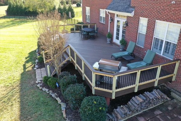 An expansive back of house Spiced Rum deck with offset seating area as well as room for lounge chairs and a grill area