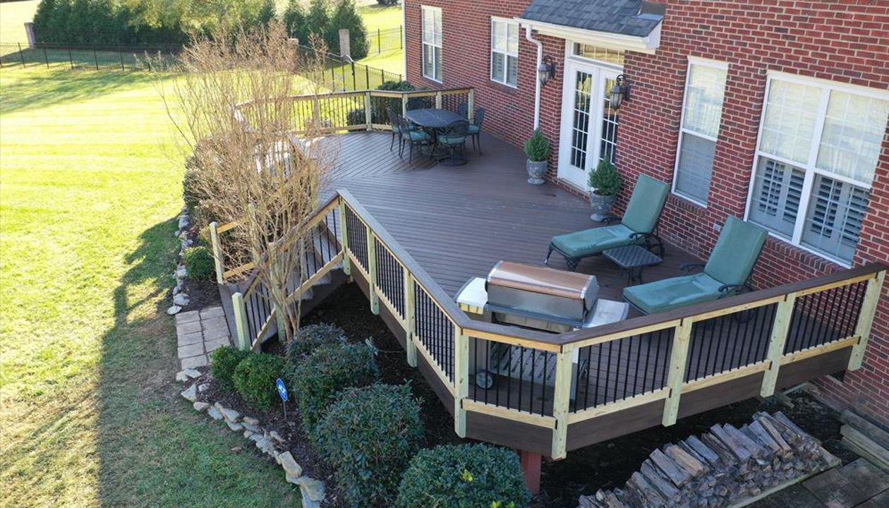 An expansive back of house Spiced Rum deck with offset seating area as well as room for lounge chairs and a grill area